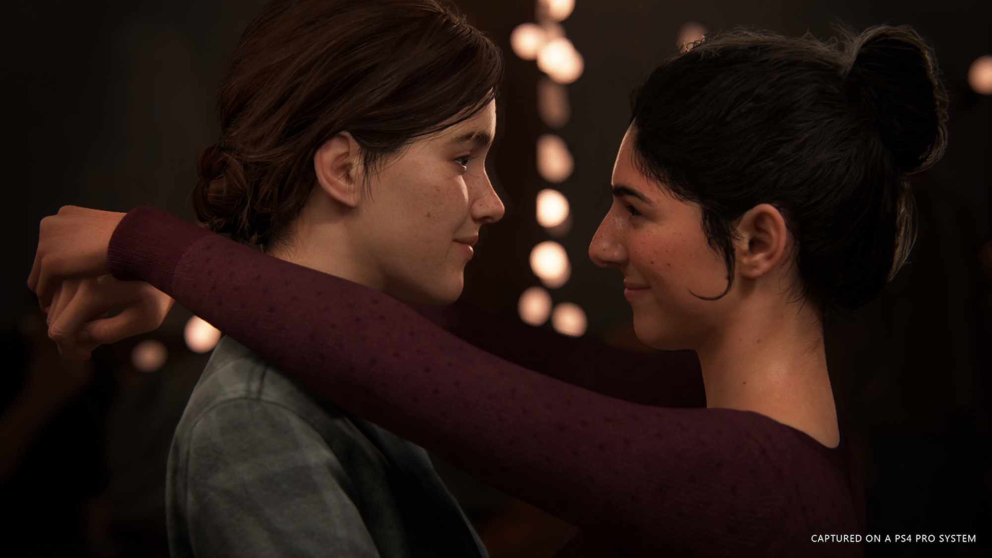 Un jeu vidéo montrant toujours deux filles dansant lentement de manière romantique l'une avec l'autre.