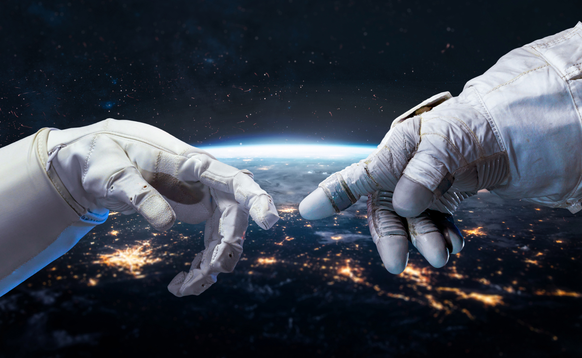 Gants d'astronautes se connectant dans l'espace