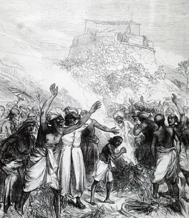 Une gravure montrant des habitants de Bekul, dans le sud de l’Inde, en 1871, exprimant leur malaise lors d’une éclipse solaire.  Une expédition britannique observe l'événement dans un fort au-dessus.