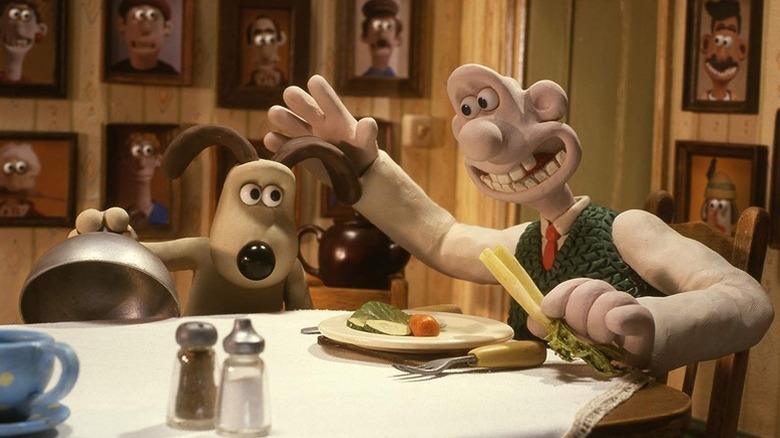 Wallace caresse Gromit dans Wallace & Gromit