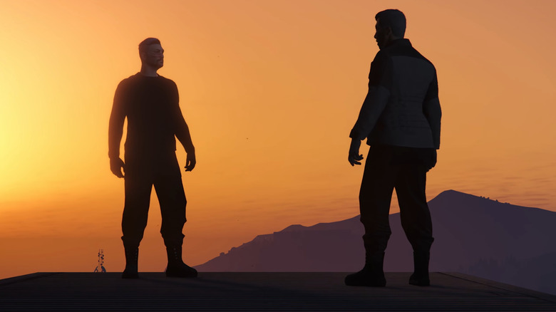 Sam et Mark debout sur une colline alors que le soleil se couche dans Grand Theft Hamlet