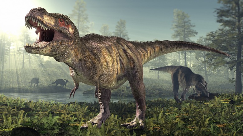 Tyrannosaurus Rex avec d'autres dinosaures près de l'eau dans la forêt