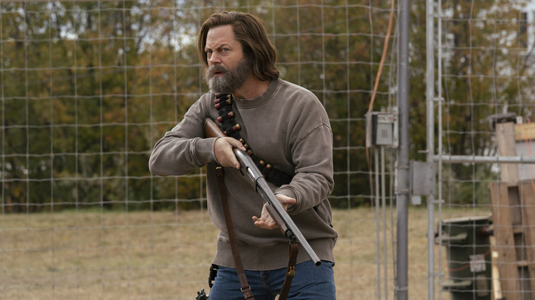 Nick Offerman comme Bill tenant son fusil de chasse dans le dernier de nous