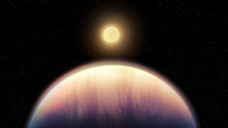 Une étoile est vue au loin avec une planète au premier plan