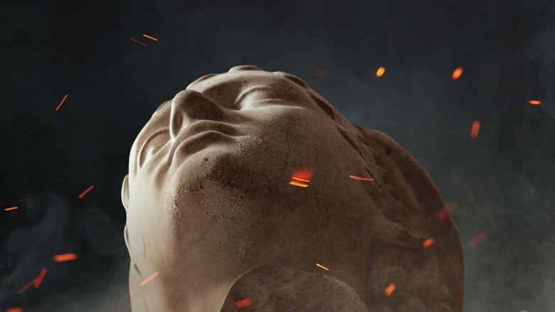 La statue avec des cendres chaudes flottant autour de sa tête sur l'affiche de The Odyssey de Christopher Nolan (2026)