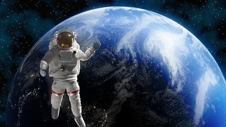 Astronaute CGI dans l'espace avec la Terre en arrière-plan