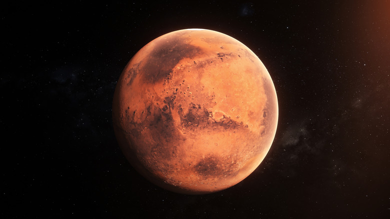 Mars est vu sur fond noir