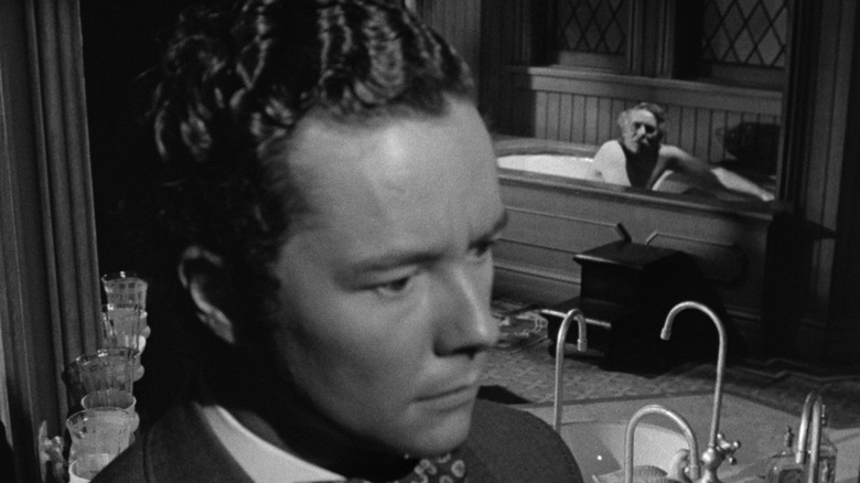 Tim Holt en tant que George Amberson Minafer qui semble concerné par le magnifique Ambersons