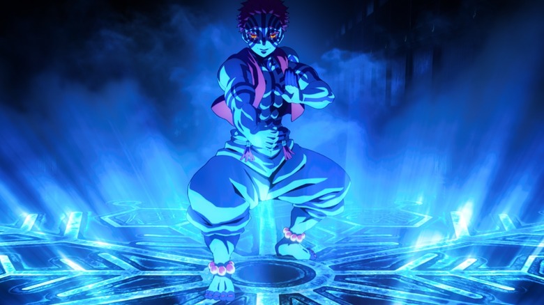 Akaza se tient au milieu d'un cercle magique et fait un stand dans Demon Slayer: Infinity Castle