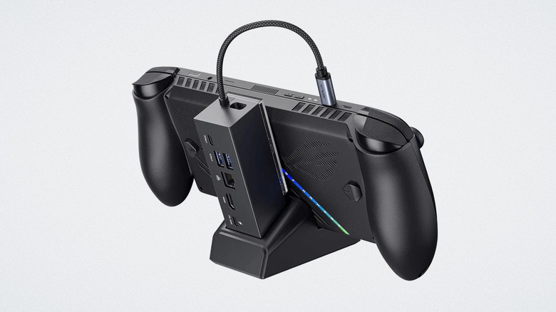 Station d'accueil JSAUX avec ordinateur de poche sur fond blanc