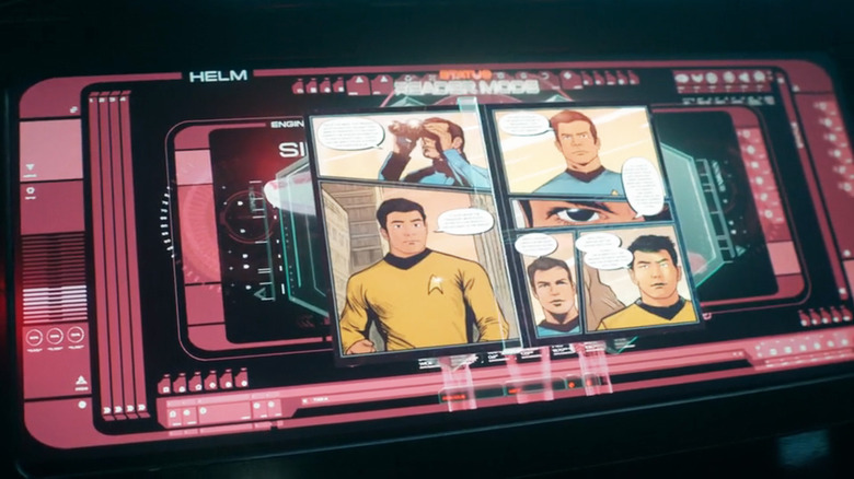 Capture d'écran de la saison 1, épisode 6 de Star Trek : Starfleet Academy représentant un écran d'ordinateur avec des pages de bande dessinée affichées sur son moniteur, représentant des officiers de Starfleet en uniformes du 23e siècle.