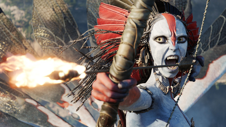 Oona Chaplin dans le rôle de Varang avec une flèche enflammée dans son arc dans Avatar : Fire and Ash