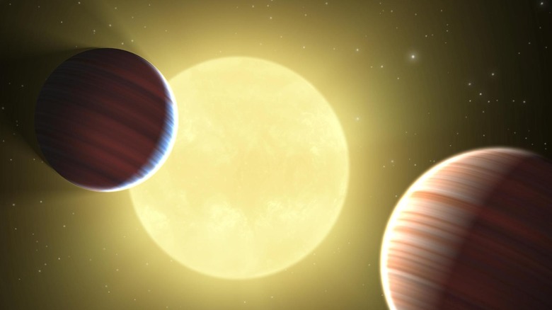 Illustration de deux planètes de la taille de Saturne découvertes par la mission Kepler de la NASA passant devant l'étoile Kepler-9.