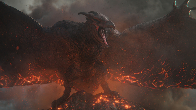 Rodan comme lui-même perché sur un volcan enflammé avec ses ailes déployées dans Monarch : Legacy of Monsters
