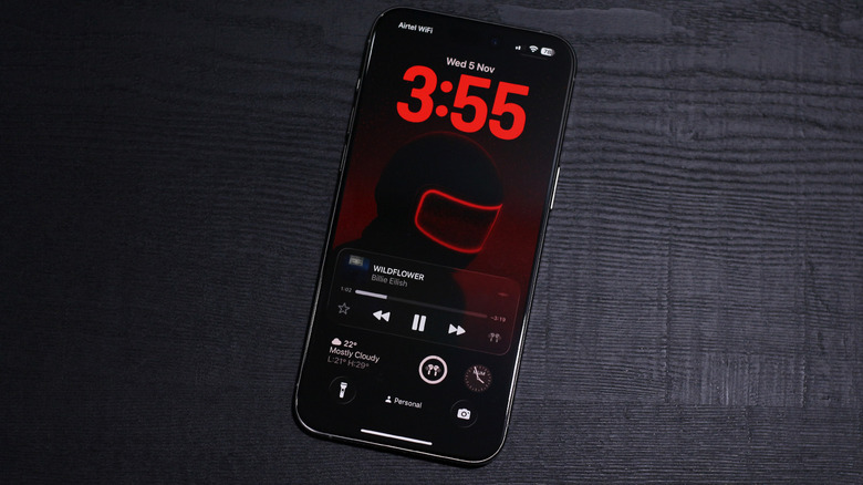 Écran de verrouillage iOS 26 avec lecture de musique