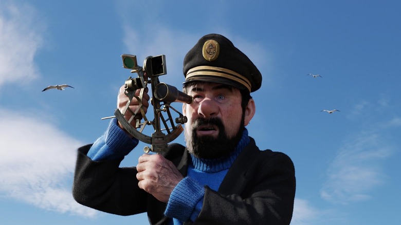 Le Capitaine Haddock regarde l'océan dans Les Aventures de Tintin