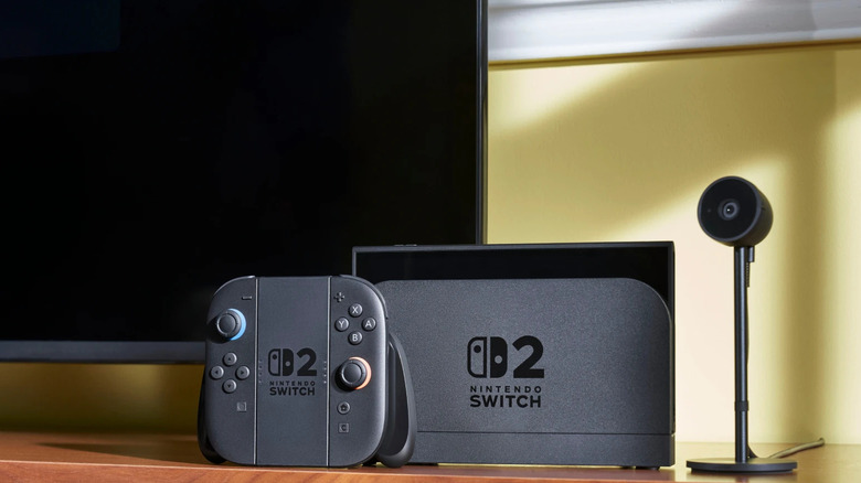 Une console Nintendo Switch 2 posée devant un téléviseur