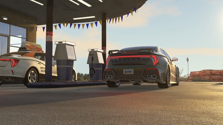 Deux voitures à la station-service dans BeamNG