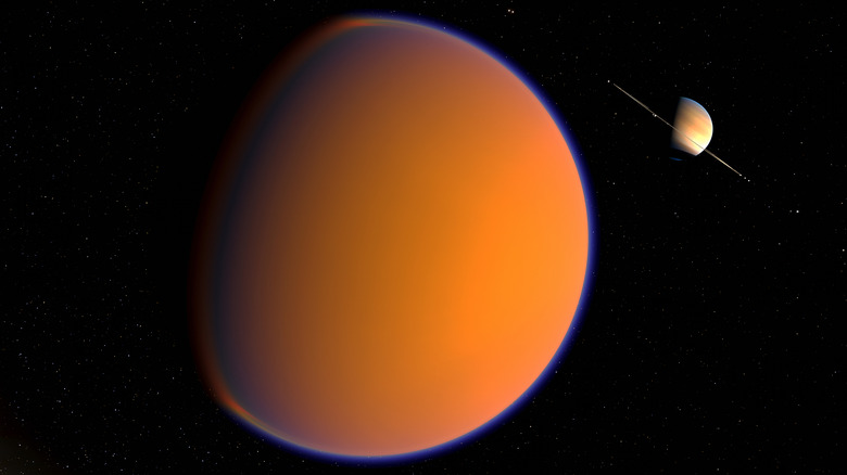 Art conceptuel numérique de Titan avec Saturne en arrière-plan