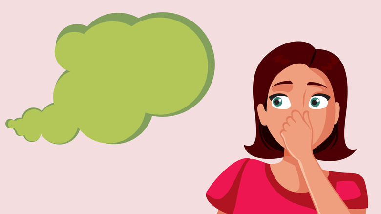 Femme de bande dessinée tenant son nez alors qu'un nuage de pet vert s'approche