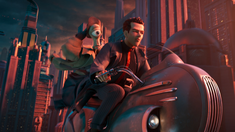 Sam Rockwell dans le rôle de Raymond Gunn pilotant un hoverbike devant Tom Waits dans le rôle d'Eyera dans Ray Gunn