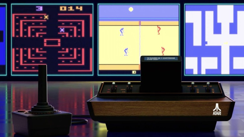 L'Atari 2600+ et sa manette devant des captures d'écran des jeux Atari 2600